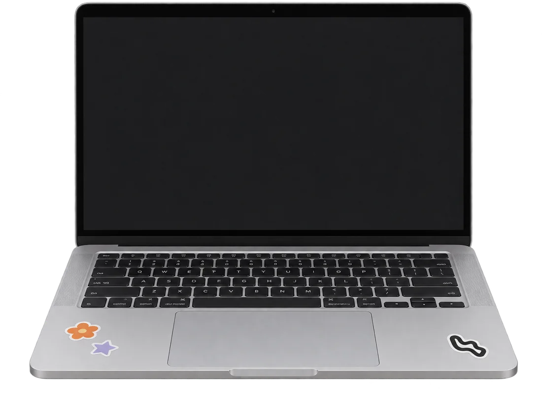 Silver MacBook with small flower and star stickers